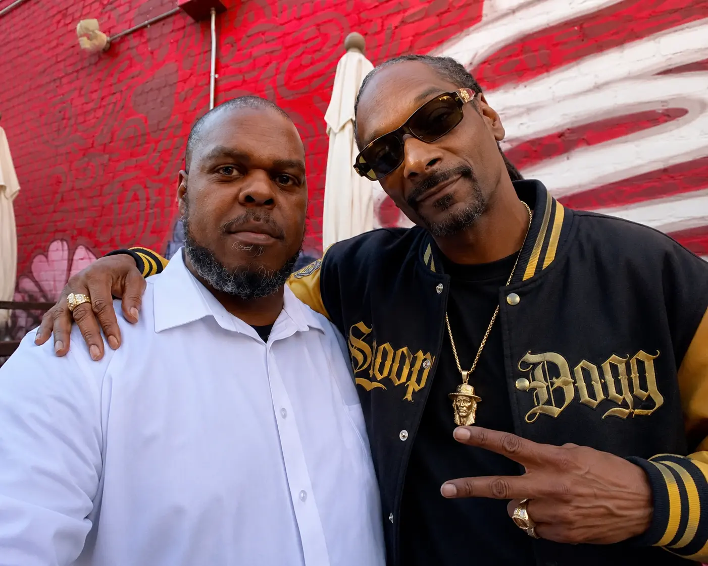 Damion Saunders alongside Snoop Dogg